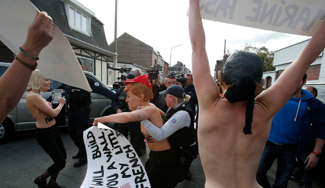 Femen: Γυμνόστηθη διαμαρτυρία στο εκλογικό τμήμα που ψήφισε η Μαρίν Λεπέν (pics & vid)