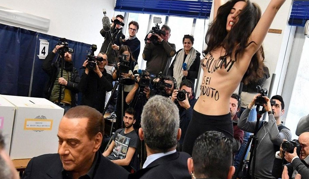 Ιταλία: Γυμνόστηθη Femen κατά Μπερλουσκόνι ενώ ψήφιζε (vid)