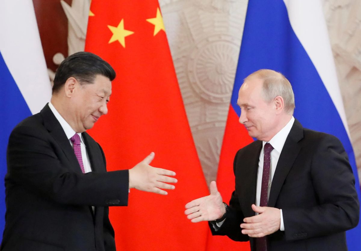 less-than-p-greater-than-russian-president-vladimir-putin-attempts-to-shake-hands-with-his-chinese-counterpart-xi-jinping-during-a-meeting-in-moscow-russia-june-5-2019-less-than-p-greater-than