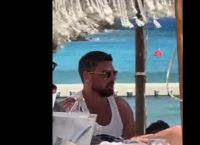 Italian star Michele Morrone wears just a red speedo in Mykonos [vid]