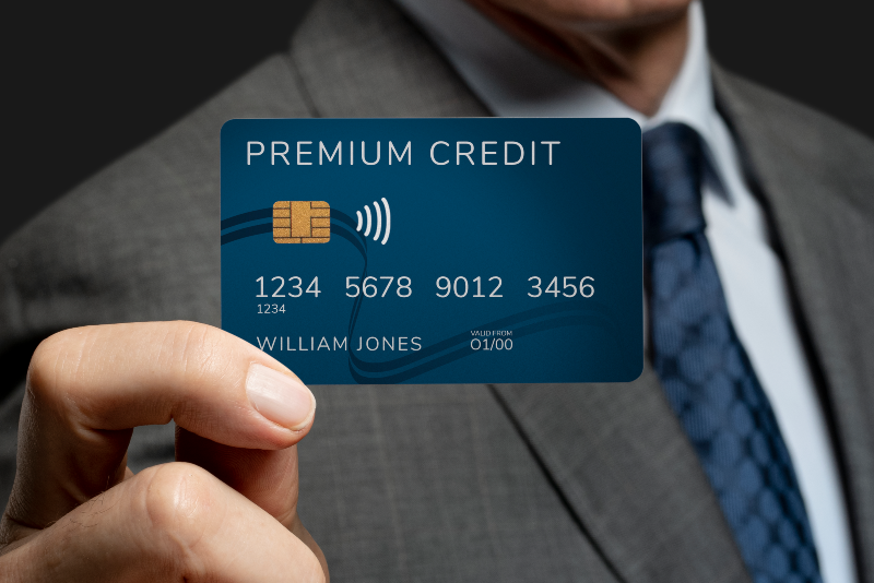 businessman showing credit card