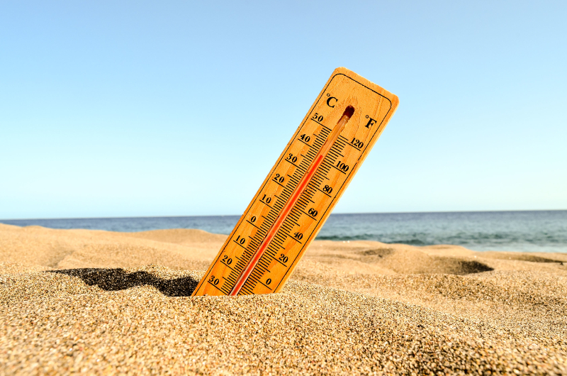 closeup shot thermometer beach sand 1